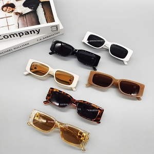 Flat lay of vintage square sunglasses set in six colors including black and tortoiseshell