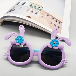 Kids purple bunny-shaped polarized sunglasses with flower detail on neutral background