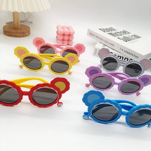 Close-up of colorful polarized children's cat-ear sunglasses in various vibrant shades