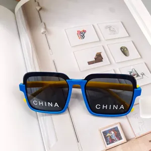 Detailed view of kids square sunglasses with contrast frame and yellow temples