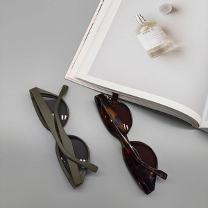 Fashionable cat-eye triangle sunglasses set in matte olive green and tortoiseshell frames