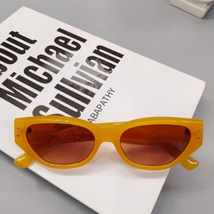 Detail view of orange square sunglasses with size 53-19-145 and silver rivets