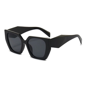 Chic black oversized polygon cat-eye sunglasses with thick frames and dark lenses