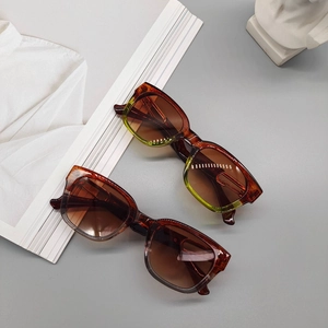 Retro square tortoiseshell sunglasses with brown gradient lenses and artistic display