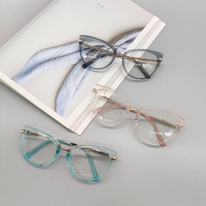 Three stylish cat-eye TR90 anti-blue light glasses in transparent grey, pink and blue