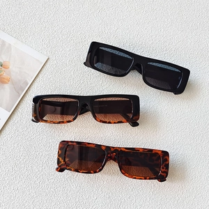Three pairs of vintage rectangle sunglasses in black and tortoiseshell finishes