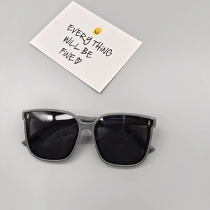 Detail of children's square sunglasses showing frame size 53-13-134 on temple arm