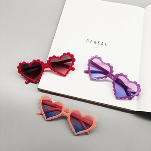 Kids heart shaped sunglasses with wavy frames and gradient lenses in multiple colors