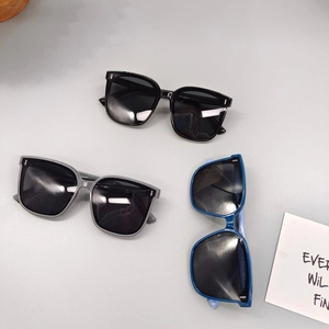 Close-up of children polarized square sunglasses in black, grey and translucent blue