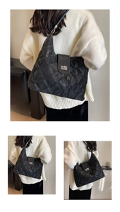 Detail of black quilted shoulder bag featuring glossy finish and silver turn-lock closure