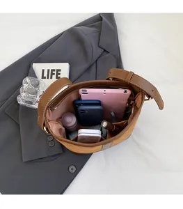 Top view of brown bucket bag interior showing spacious compartments and storage capacity