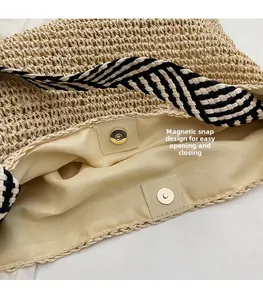 Detail of straw tote bag showing internal lining and gold magnetic snap closure