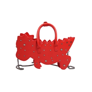 Quirky red dinosaur shaped crossbody bag with silver studs and a metal chain strap