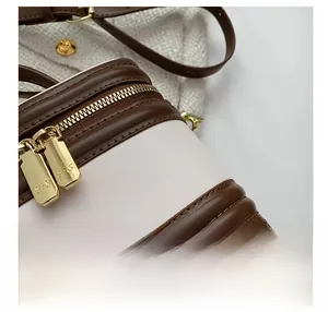 Detailed close-up of premium contrast stitching and golden dual zipper on retro box bag