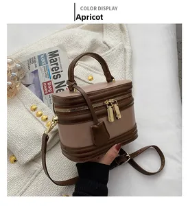 Detail shot of the apricot PU leather crossbody bag featuring vintage gold hardware