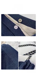 Detail of denim tote bag with magnetic clasp, herringbone lining and chain strap