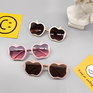 Cute apple-shaped cartoon sunglasses for kids in cream, pink, and rose colors