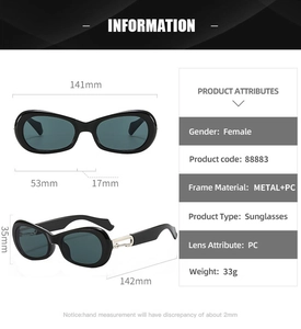 Detailed view of black oval sunglasses showing metal buckle hinge and frame dimensions
