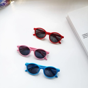 Oval jelly-colored polarized kids sunglasses set in red, pink, and blue shades