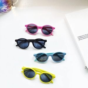 Oval jelly-colored polarized kids sunglasses with UV protection in four vibrant colors