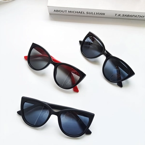 Close-up of three vintage cat-eye children's polarized sunglasses with gradient lenses
