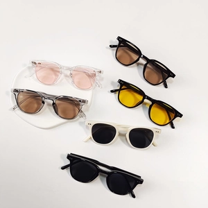 Retro round frame kids sunglasses with rivet details and colorful lenses in various options