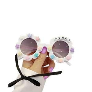 Cute white flower children sunglasses with colorful stars and UV protection lenses
