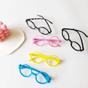 Cute kids round eyewear frames in five colors displayed with minimalist props