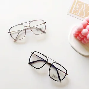 Lunettes anti-lumière bleue à double pont avec montures polygonales en argent et noir doré