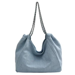 Stylish light blue denim tote bag with silver chain straps and large capacity design