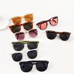 Flat lay of colorful foldable children's sunglasses with classic square frames and UV protection