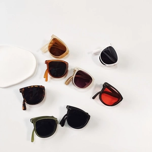 Foldable children's sunglasses with colorful lenses and UV protection in multi-color array