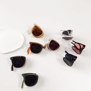 Foldable kids sunglasses in assorted colors with portable frame and UV400 ocean lenses
