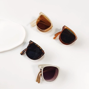 Foldable children's sunglasses in amber, orange, tortoiseshell, and grey color options