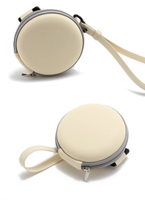 Detailed view of a round beige EVA sunglasses case with a grey zipper and carry strap