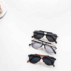 Three pairs of stylish pilot sunglasses for kids with colorful lenses and metal frames