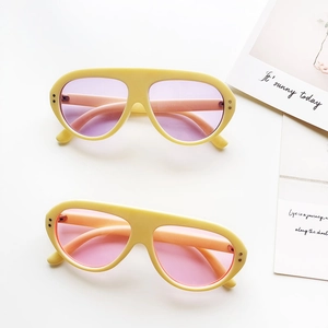 Retro oval children's sunglasses with thick yellow frames and purple or pink lenses