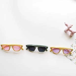 Three pairs of retro cat-eye sunglasses for kids in yellow and olive green colors