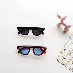 Retro cat-eye children's sunglasses in black and tortoiseshell with blue lenses