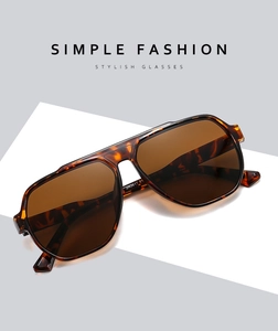 Detail view of tortoiseshell aviator sunglasses with brown lenses and a double bridge