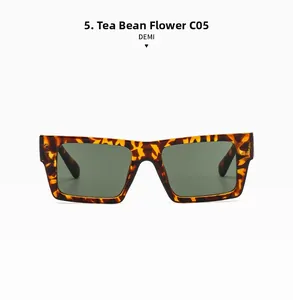 Detail view of small frame sunglasses in demi tortoise finish with C05 green lenses