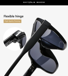 Close-up of flexible metal hinges and high-quality glossy black frame on sunglasses