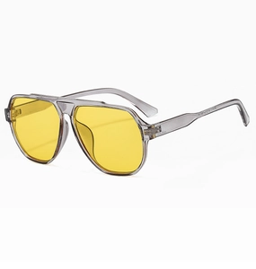 Detail of aviator sunglasses with transparent grey frame and yellow teardrop lenses
