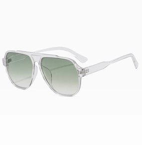 Detail view of retro oversized pilot sunglasses with transparent frames and green lenses