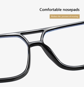 Macro shot of comfortable integrated nose pads on black double bridge glasses frames