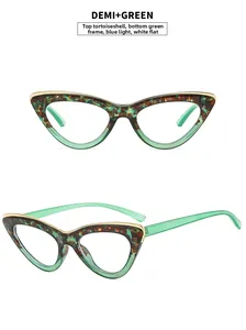 Detail of cat eye glasses with tortoiseshell and green frame plus blue light lenses