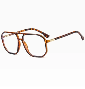 Detail of tortoise shell polygon glasses frames with golden metal hinge accents