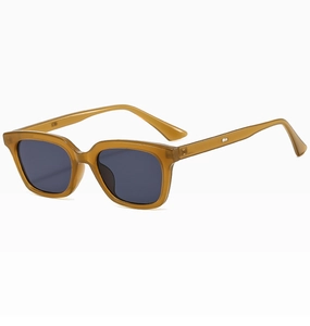 Detail view of transparent amber square frame sunglasses with dark grey lenses and metal hinges