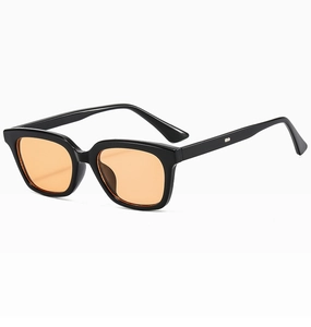 Detail of square black frame sunglasses with amber lenses at a 45-degree angle