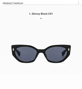 Detail einer Cat-Eye-Sonnenbrille mit glänzend schwarzem Rahmen und goldenen Streifen